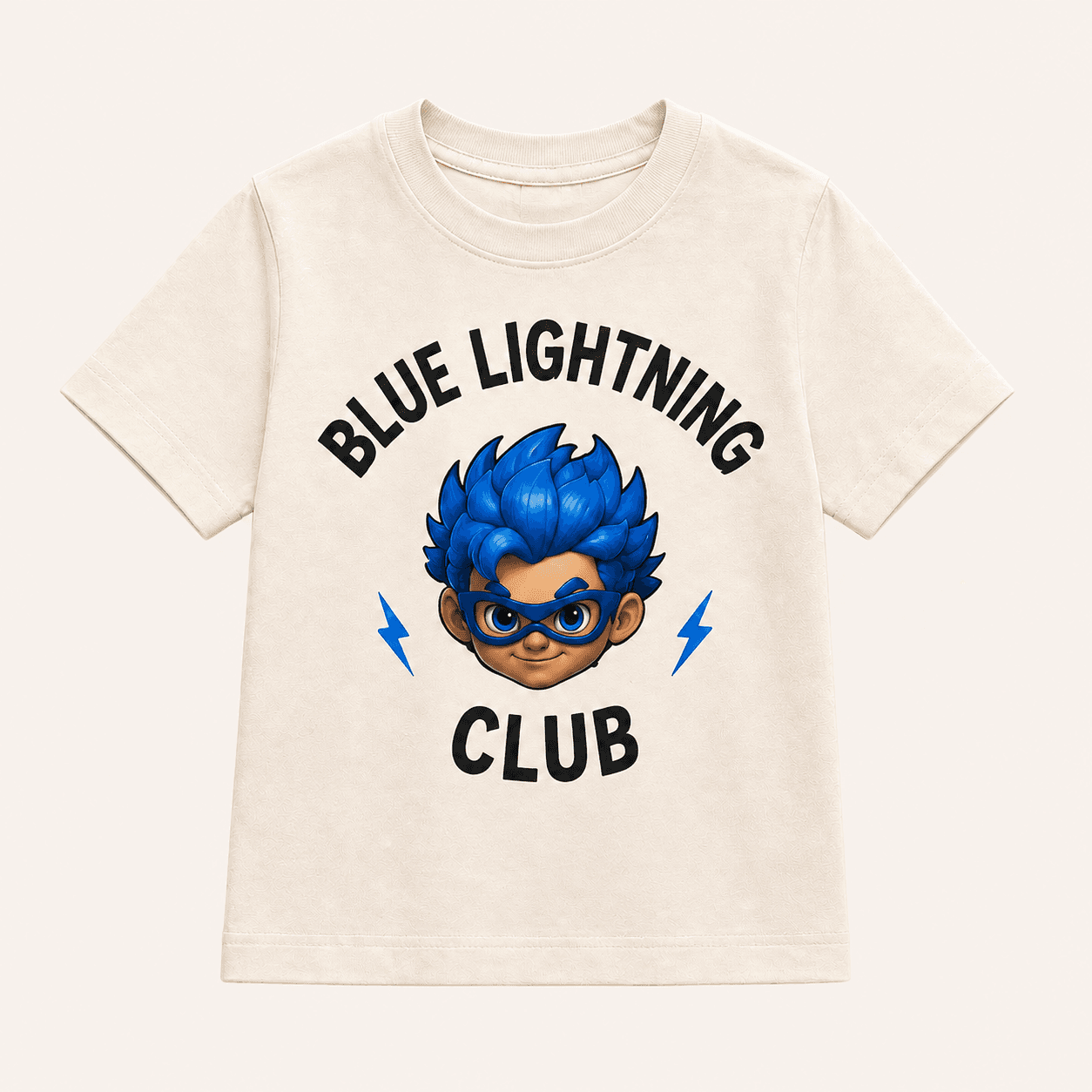 Cream kids tee with a Blue Lightning Club crest and Kai character graphic