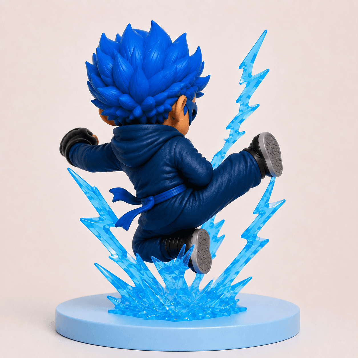 Rear view of the Kai vinyl figure showing the hooded gi and sculpted hair detail